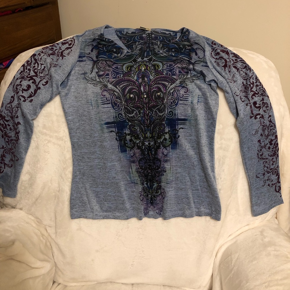 Live and let live long sleeve embellished top.